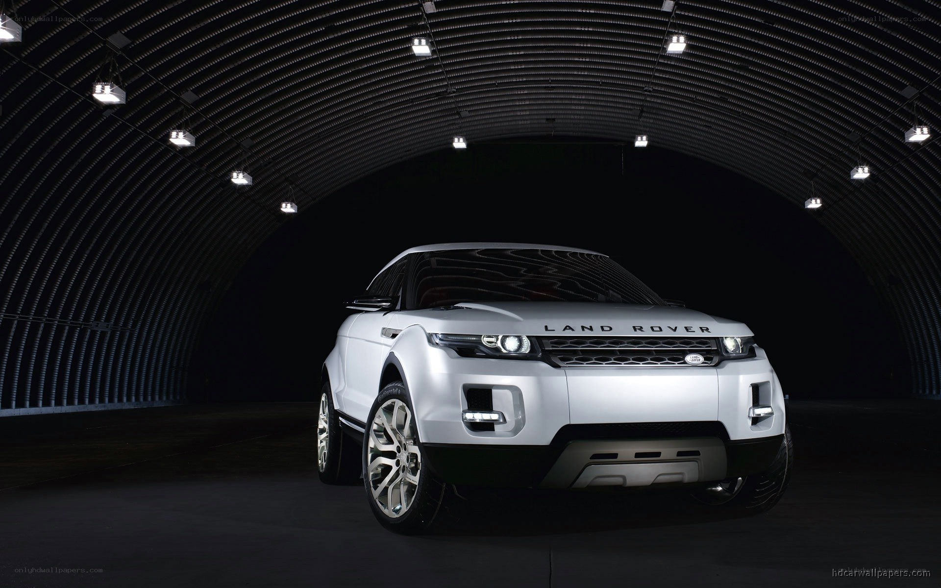 White Land Rover in a tunnel