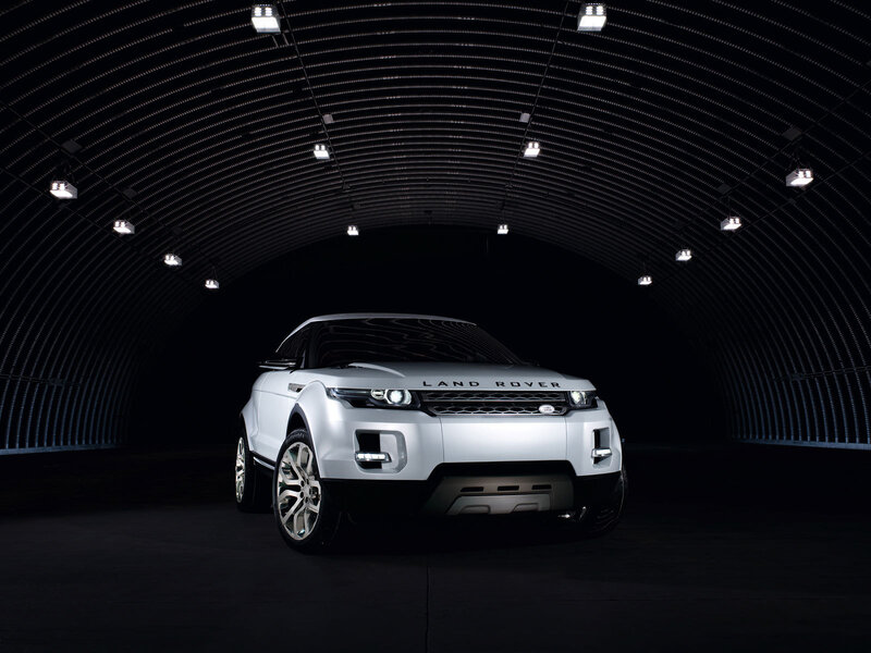 White Land Rover in dark tunnel