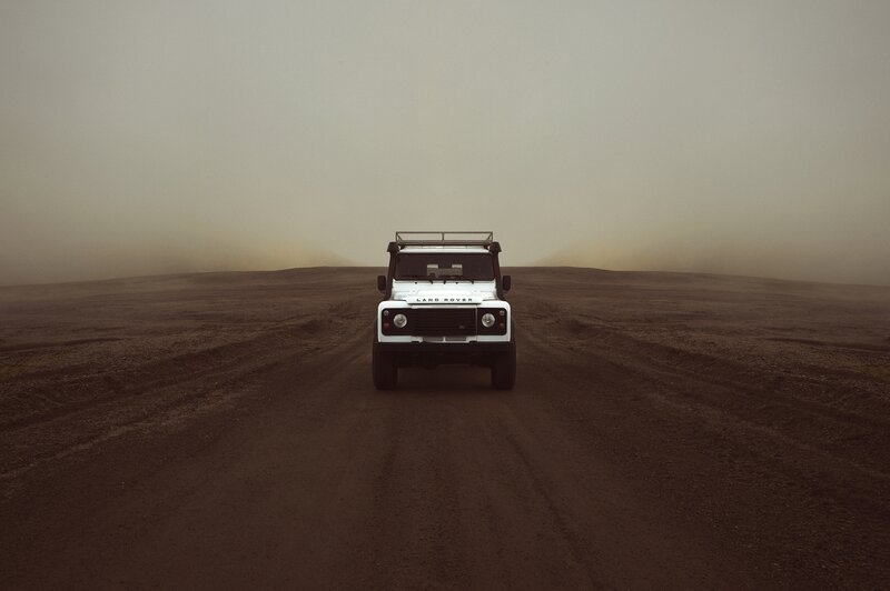 White Land Rover in Desert