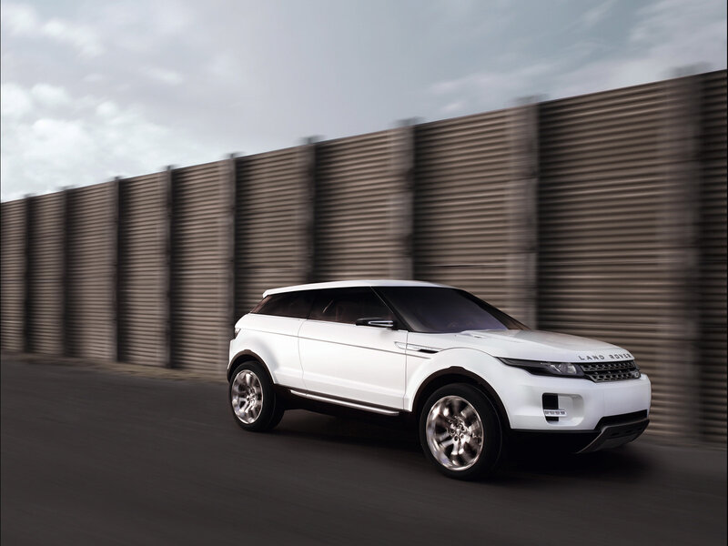 White Land Rover in motion
