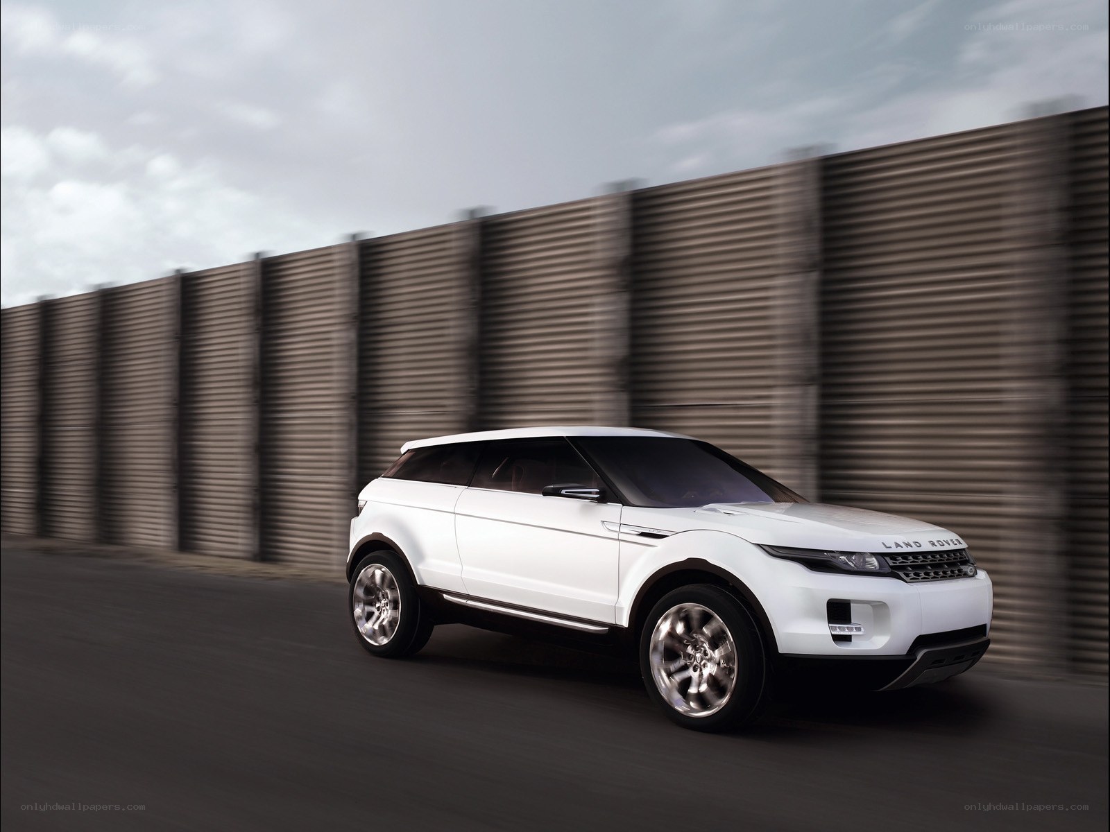 White Land Rover in motion