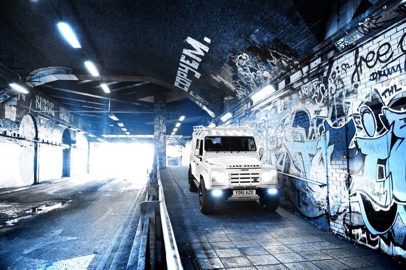 white land rover in tunnel