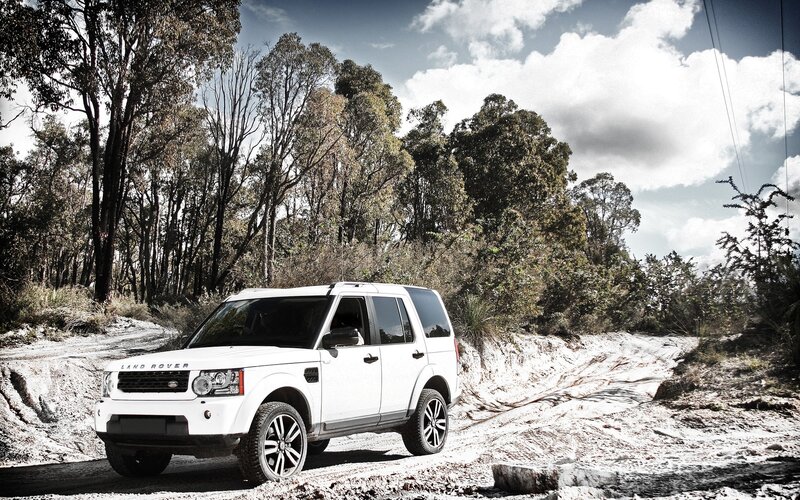 White Land Rover on dirt road