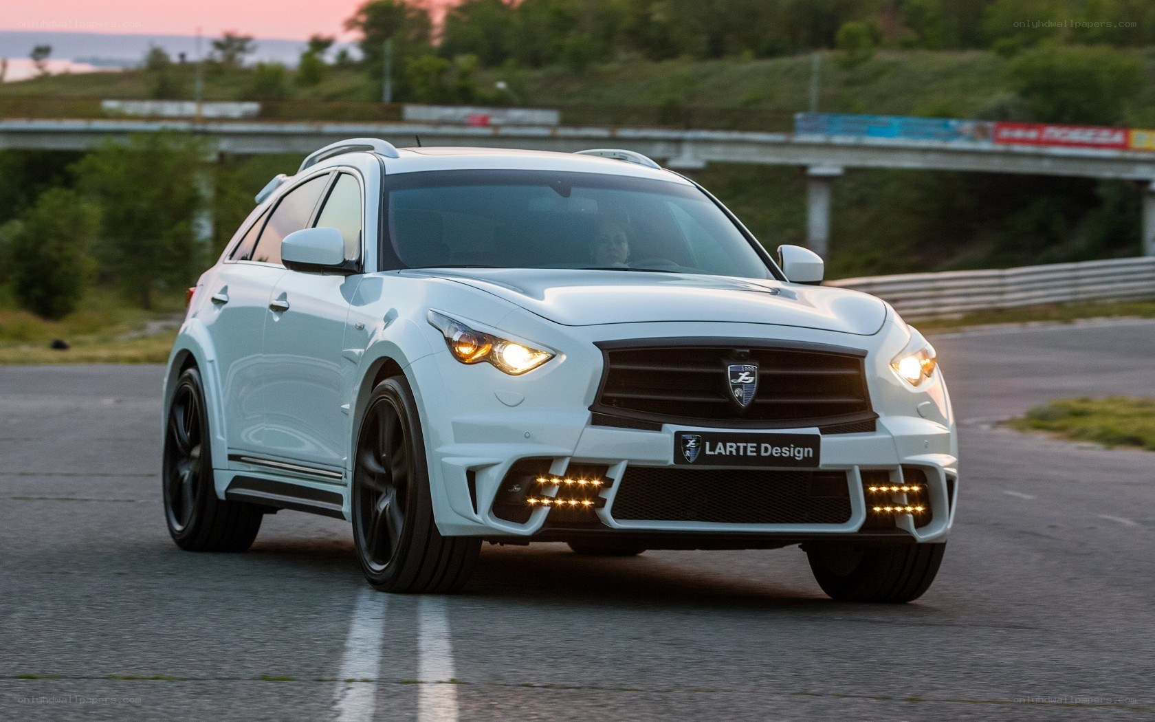 White Larte Design SUV on track