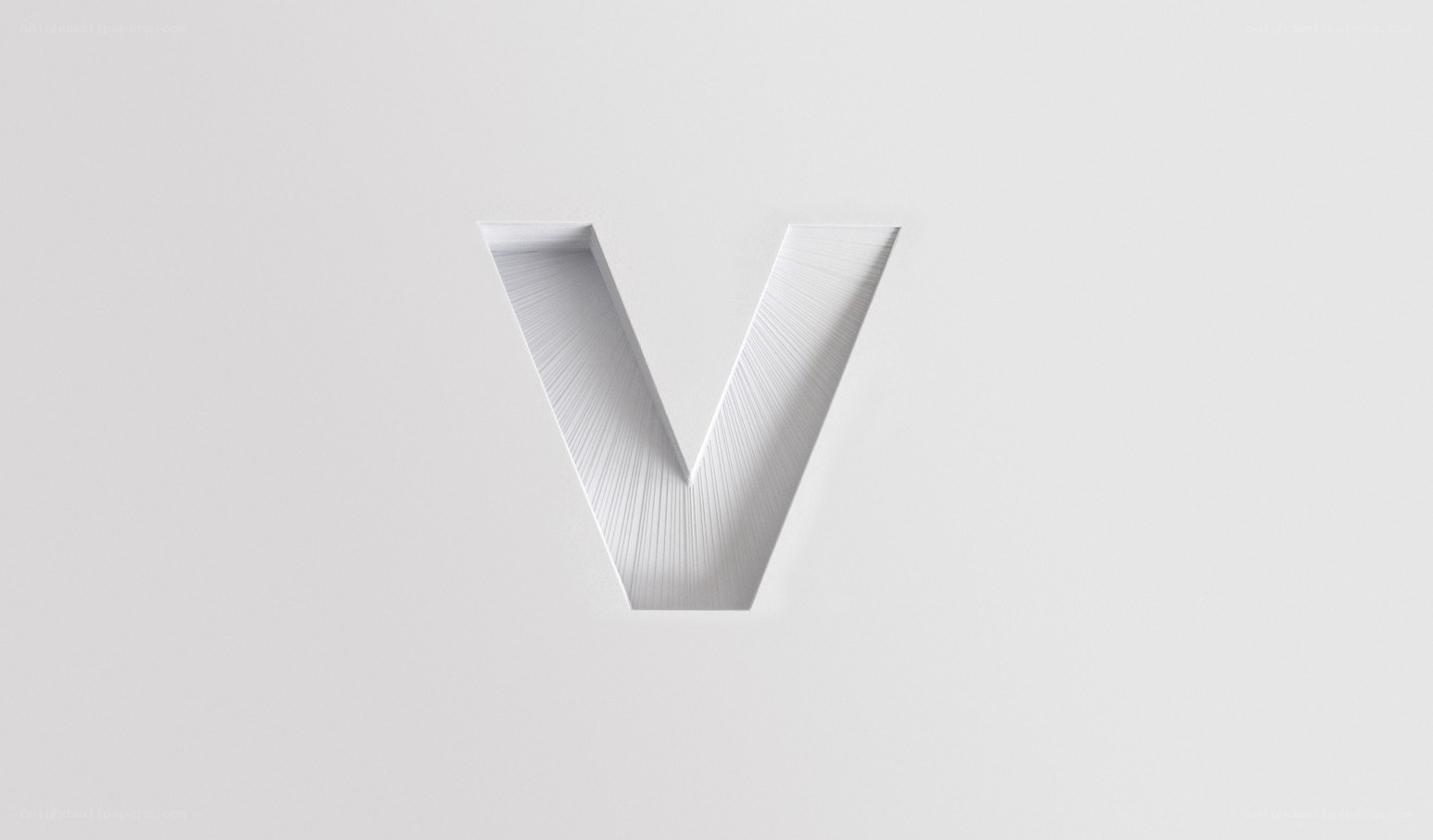 white letter V on gray background