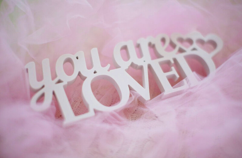 White Letters on Pink Fabric