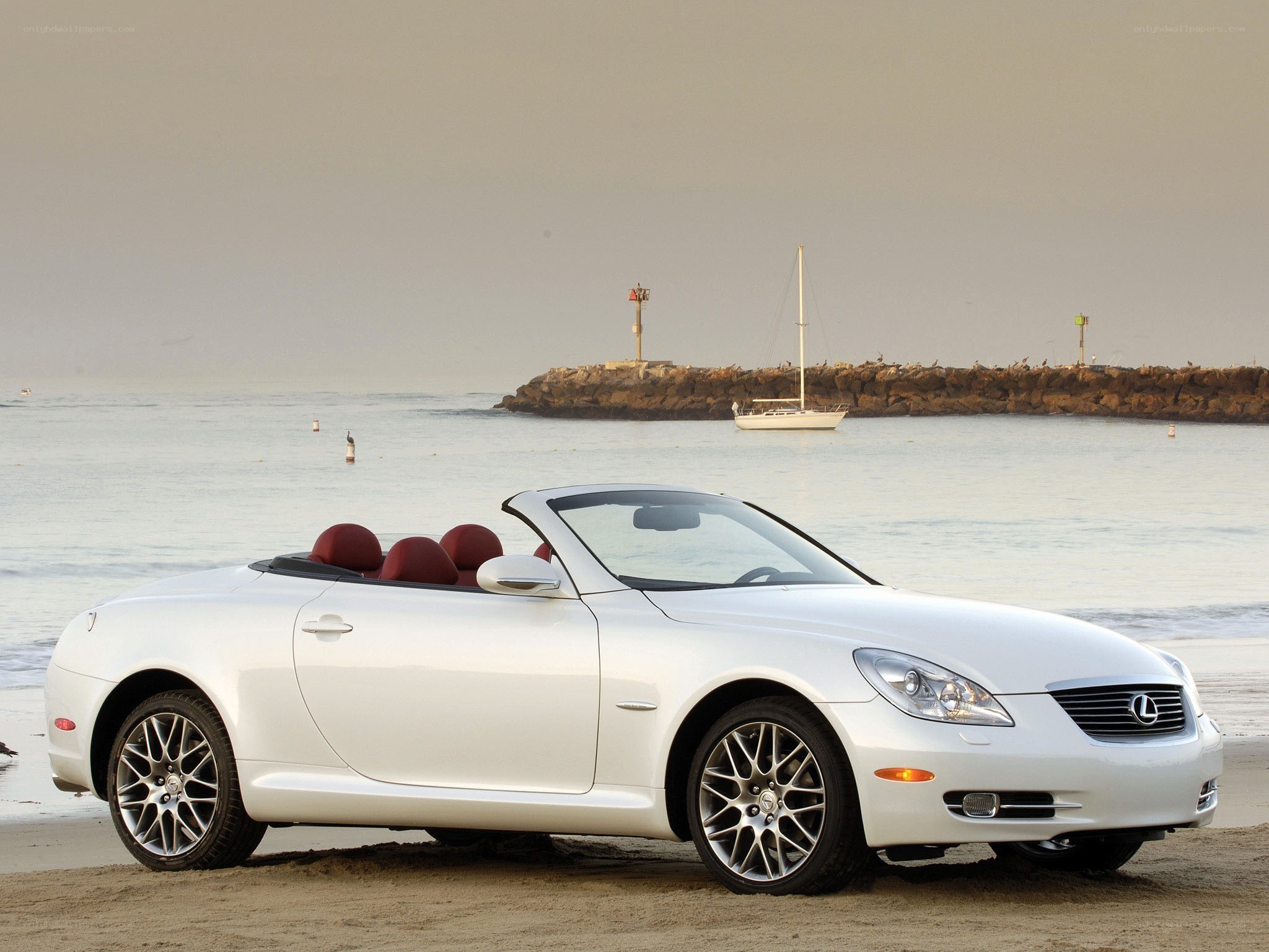White Lexus convertible on beach