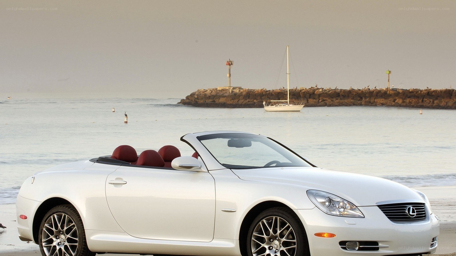 White Lexus convertible on beach