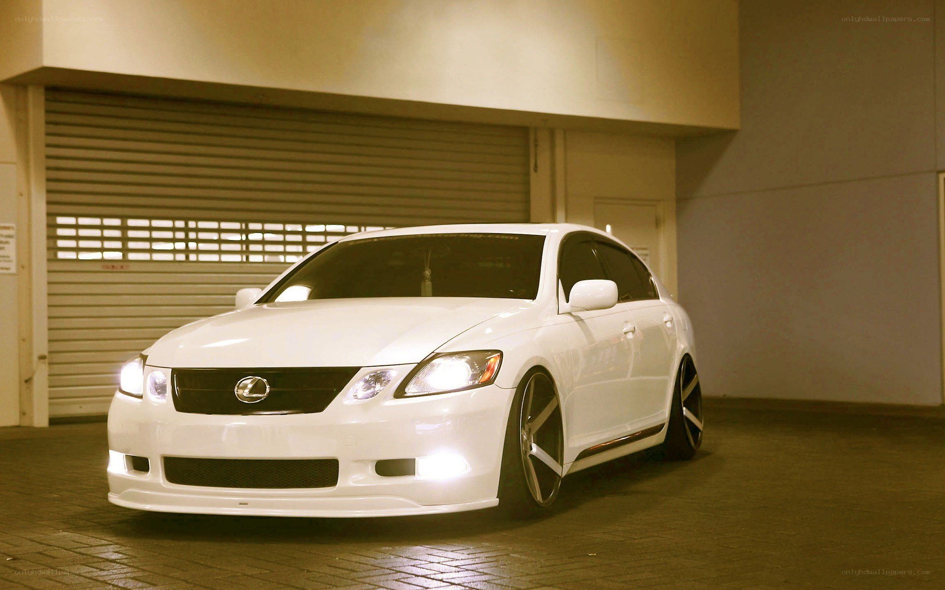 White Lexus GS in garage