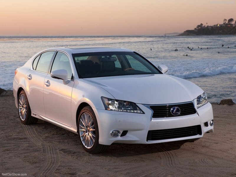 White Lexus GS on beach at sunset