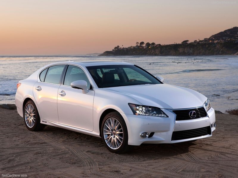 White Lexus GS on beach at sunset