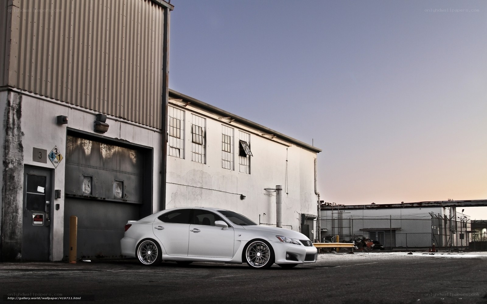 White Lexus in industrial lot