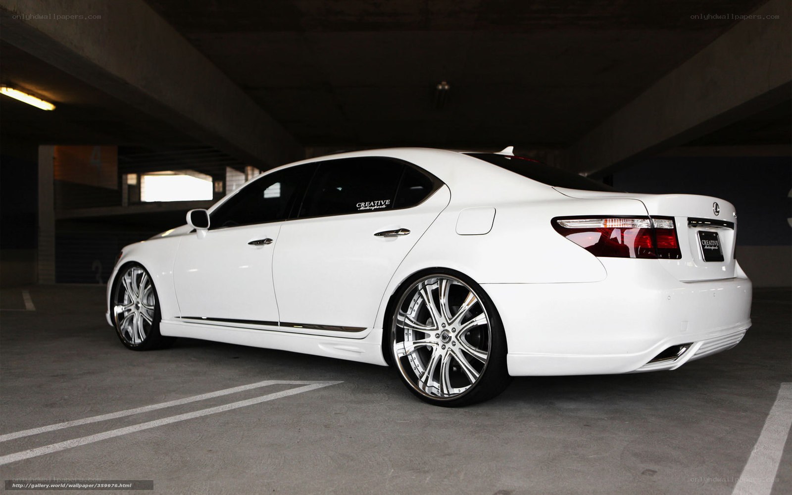 white lexus in parking garage