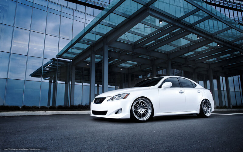 White Lexus IS300 in front of modern building