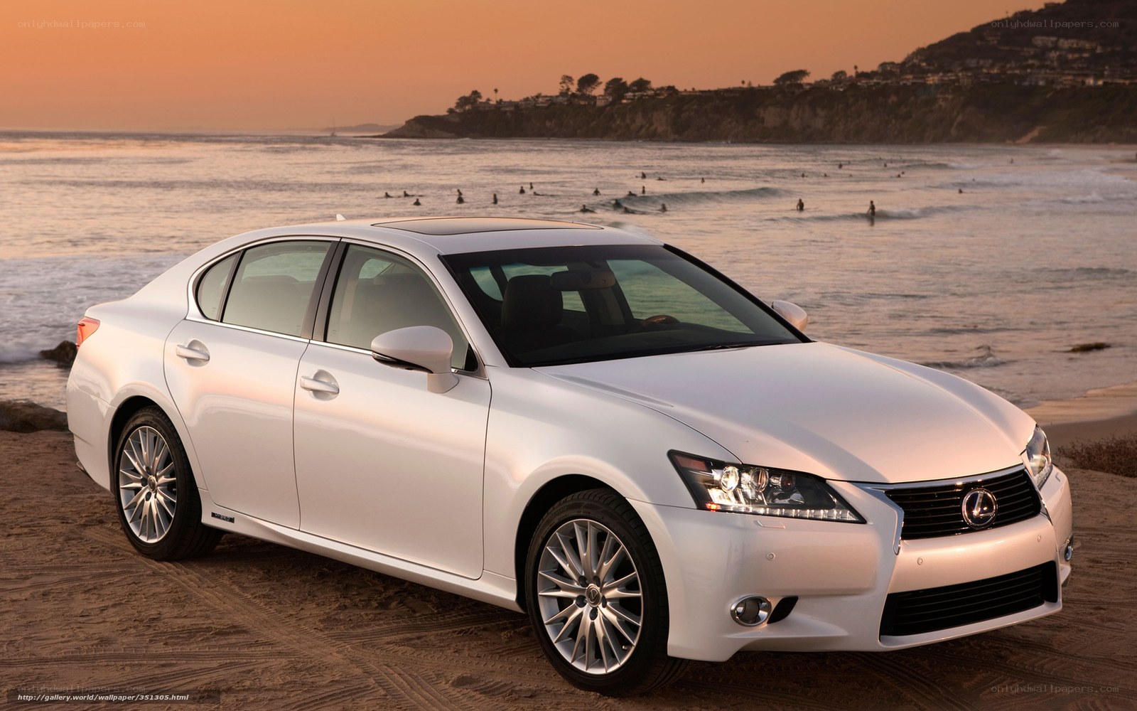 White Lexus on beach at sunset