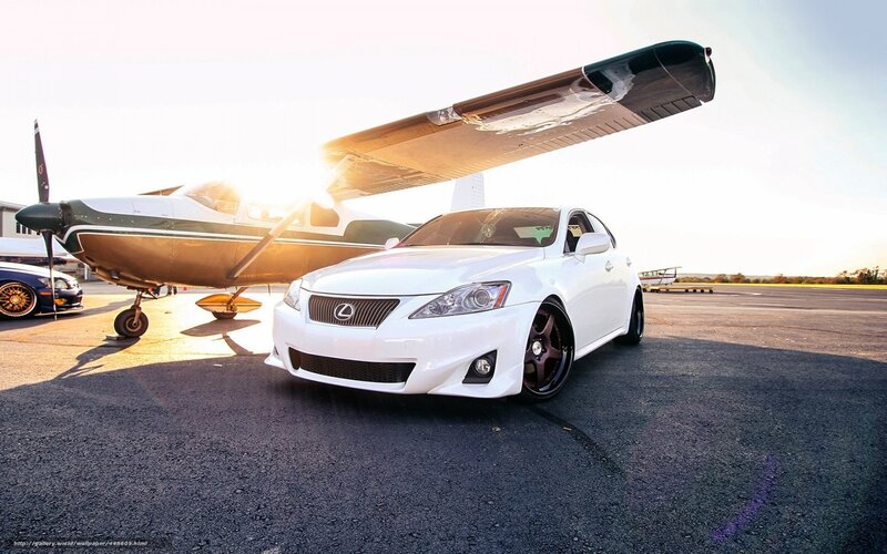 White Lexus on tarmac with plane