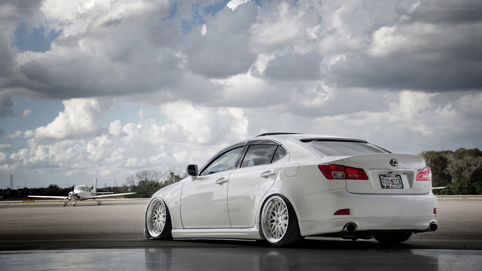 white lexus on tarmac