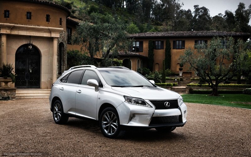 White Lexus RX in front of mansion