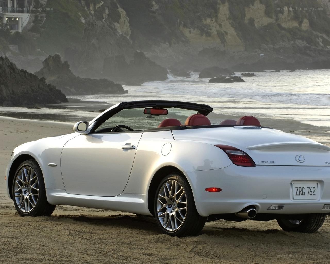 White Lexus SC convertible on beach
