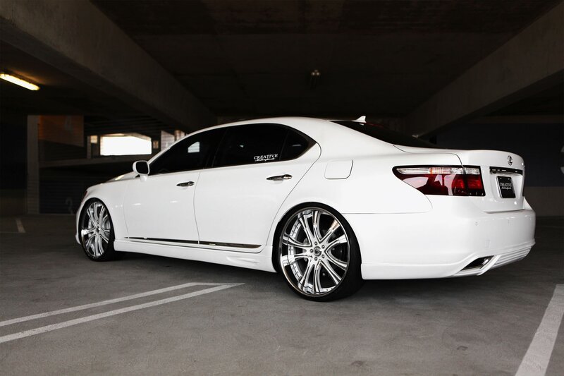 white lexus sedan in parking garage
