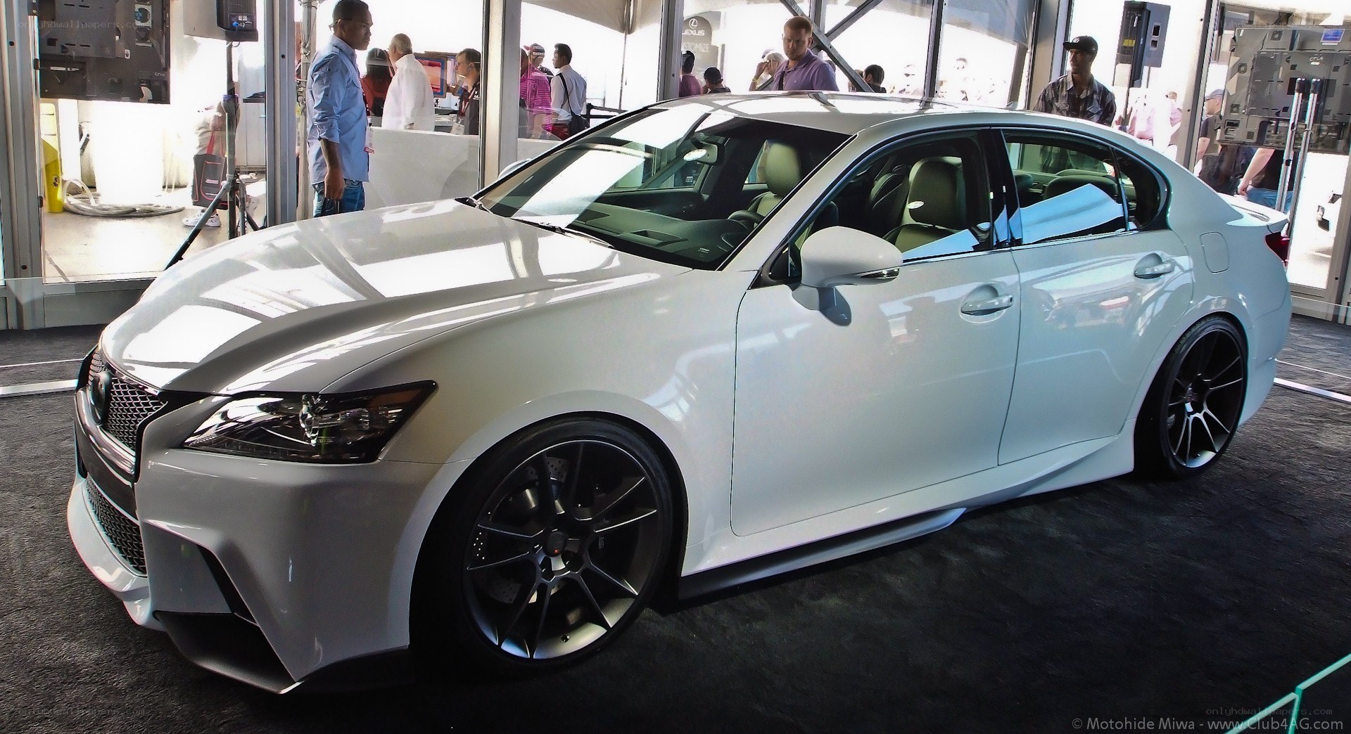 white lexus sedan on display