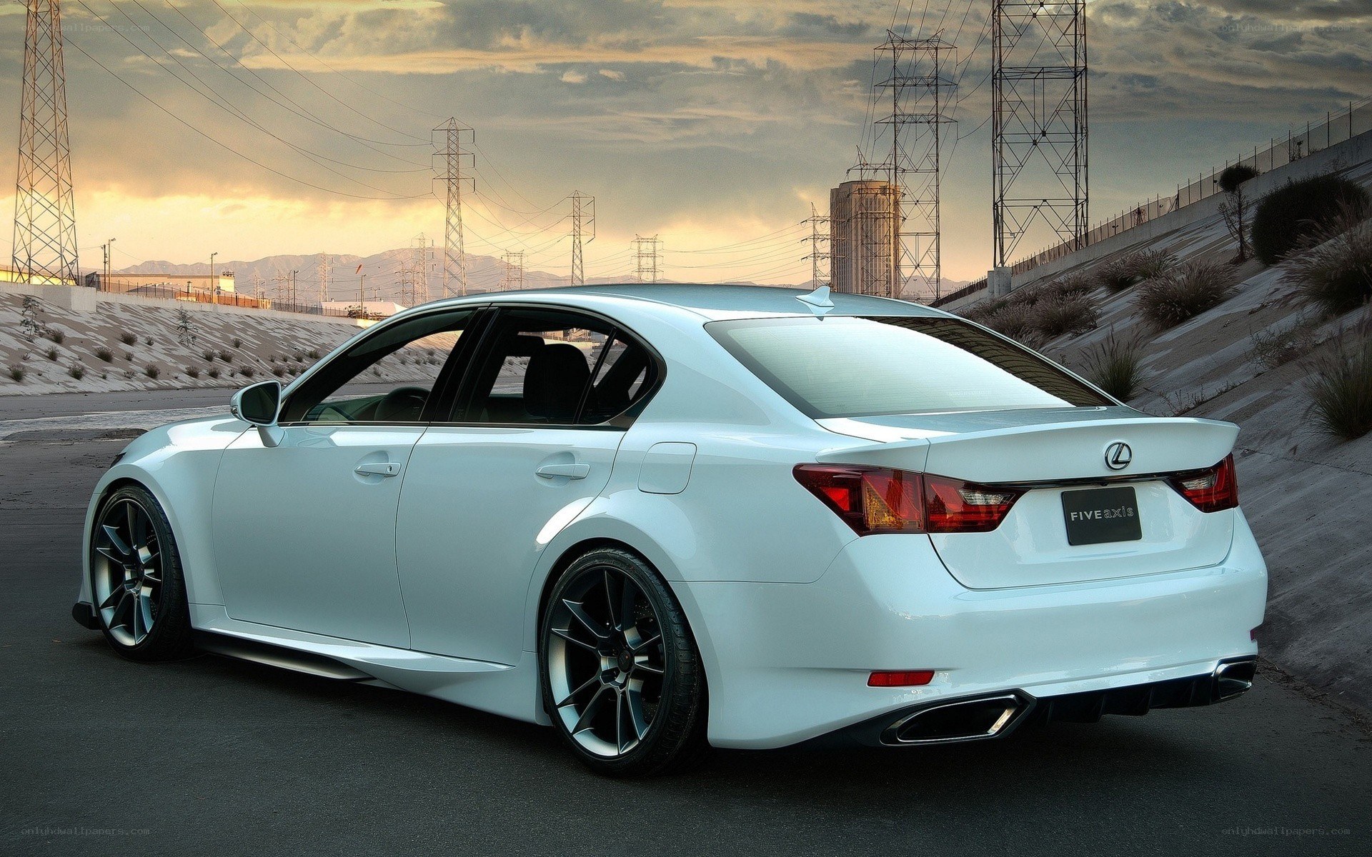 white lexus sedan on road