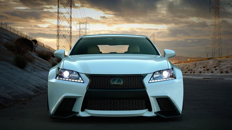 White Lexus sports car at sunset