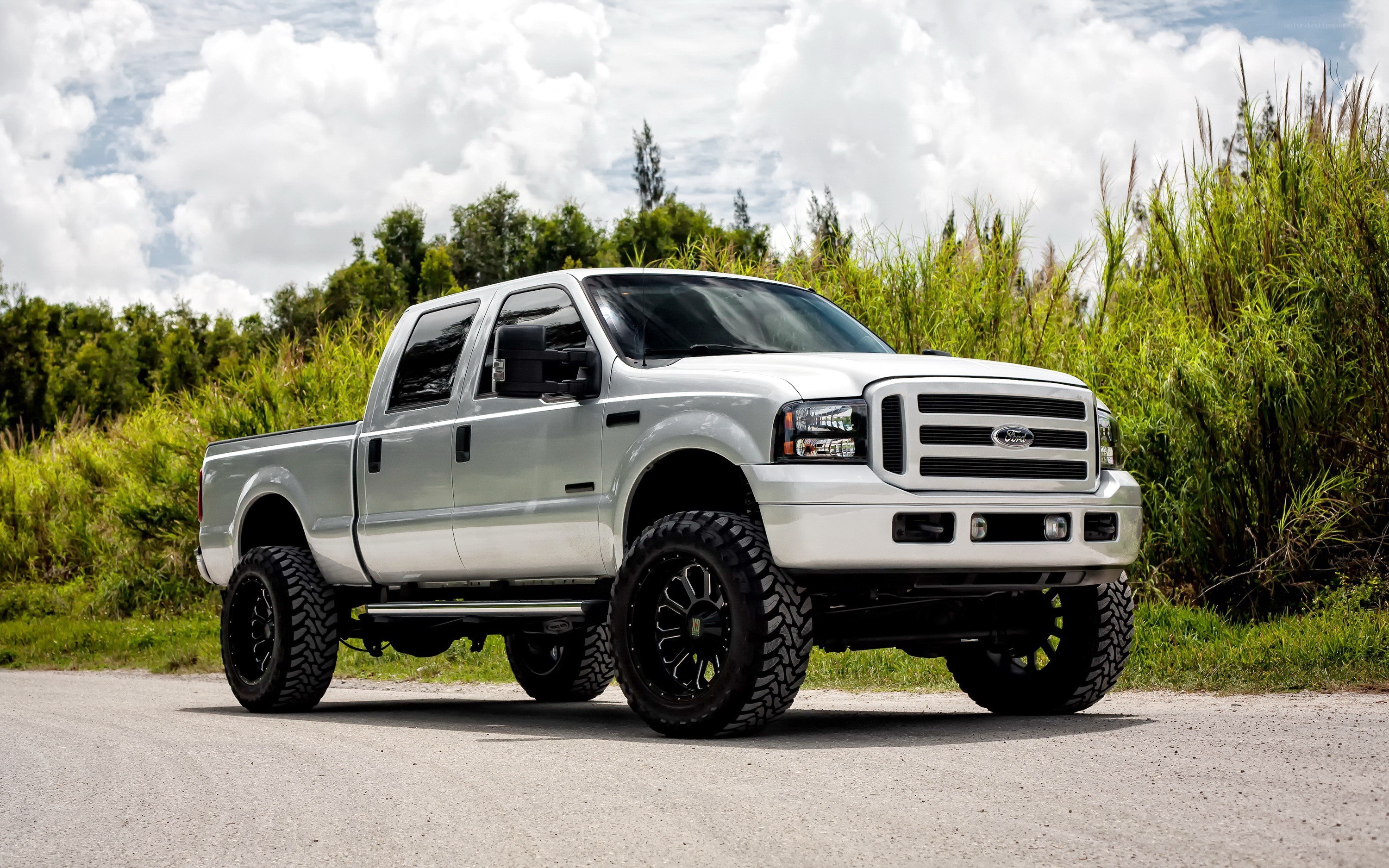 White lifted Ford pickup truck