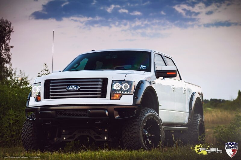 white lifted Ford pickup truck