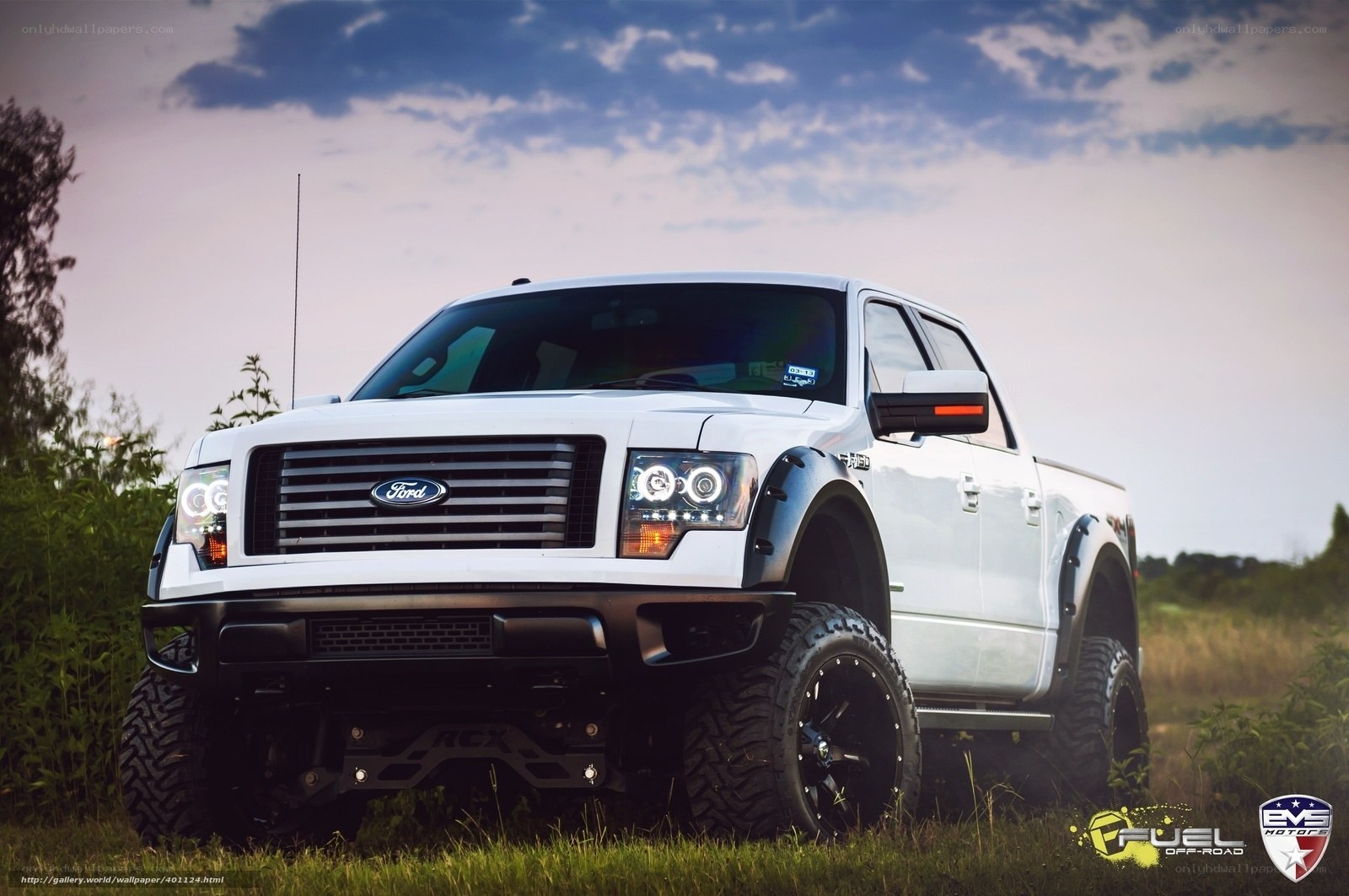 white lifted Ford pickup truck