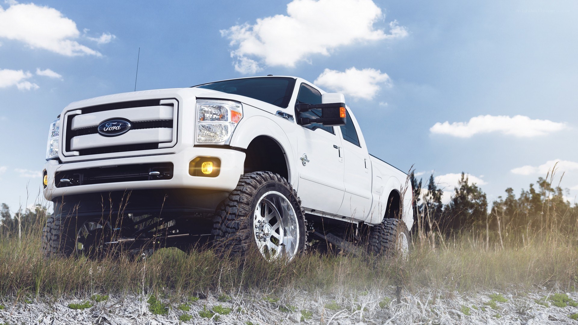 white lifted Ford truck