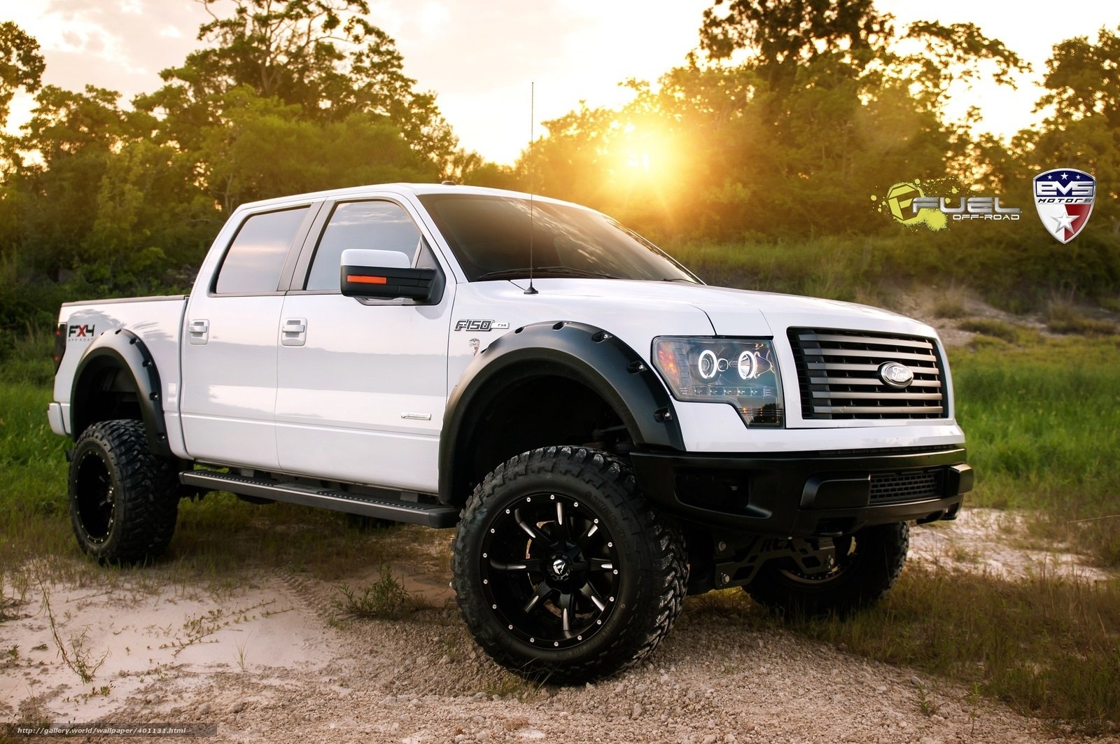 white lifted truck at sunset