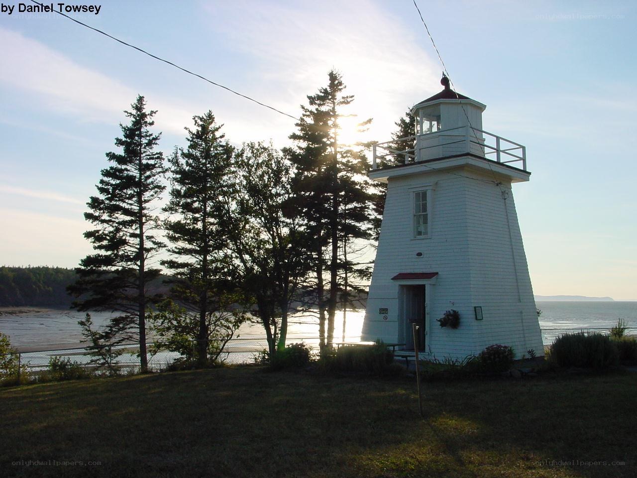 White lighthouse by the sea