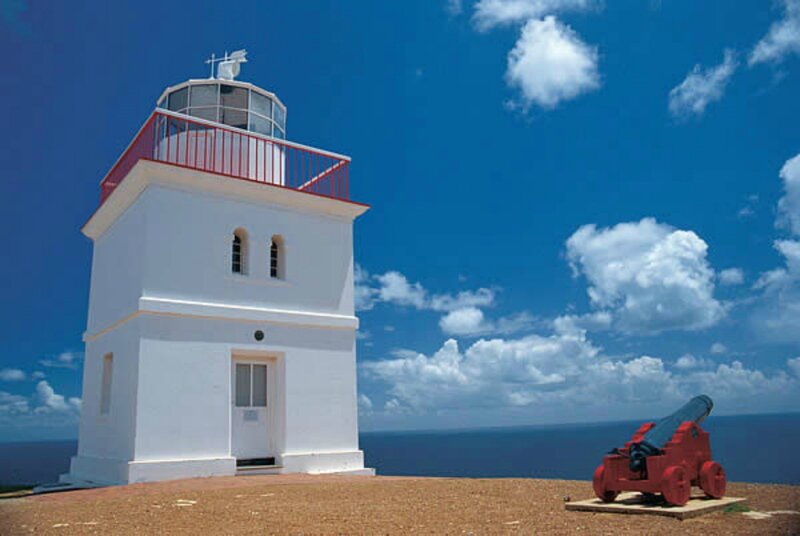 White Lighthouse on Cliff — Blue, Serene