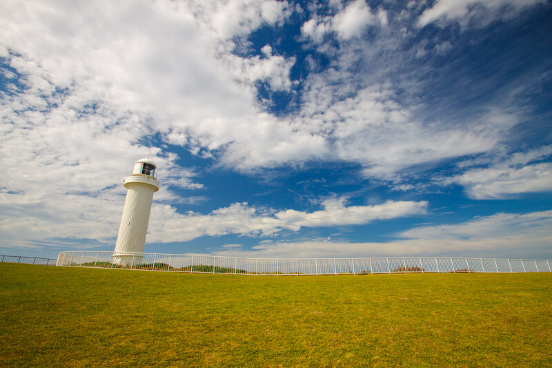 White Lighthouse on Hill — Green, Serene