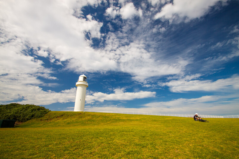 White Lighthouse on Hill — Green