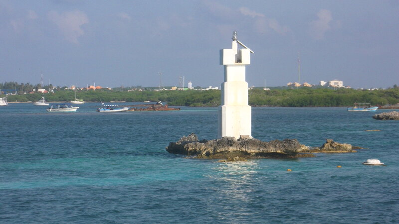 White Lighthouse on Rock — Blue