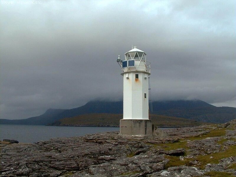 White Lighthouse on Rocks — Gray