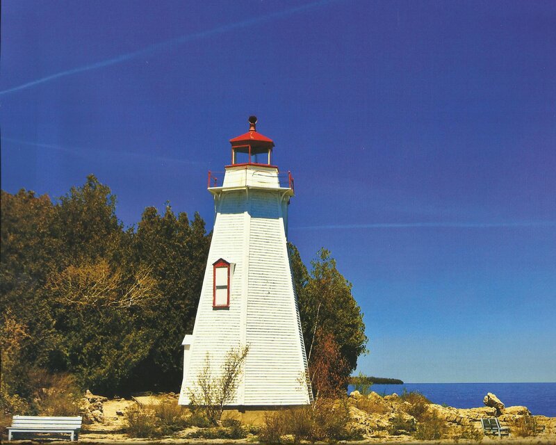 White Lighthouse on Shore