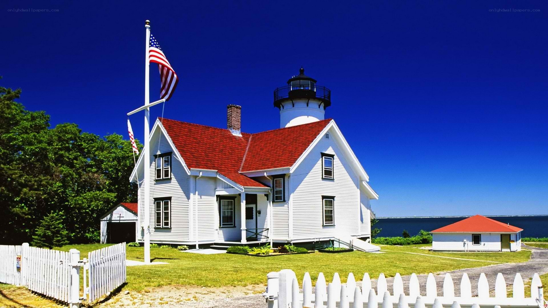 White lighthouse with red roof