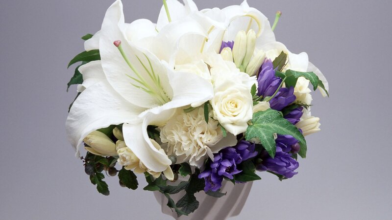 white lilies and purple flowers