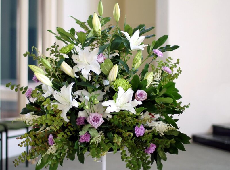 white lilies and purple roses