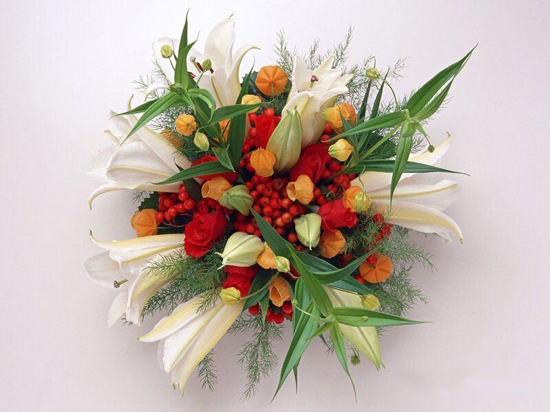 white lilies and red berries bouquet