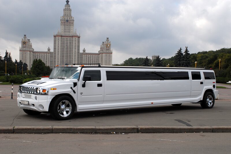 White limousine in front of a building