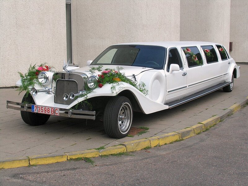 white limousine with flowers