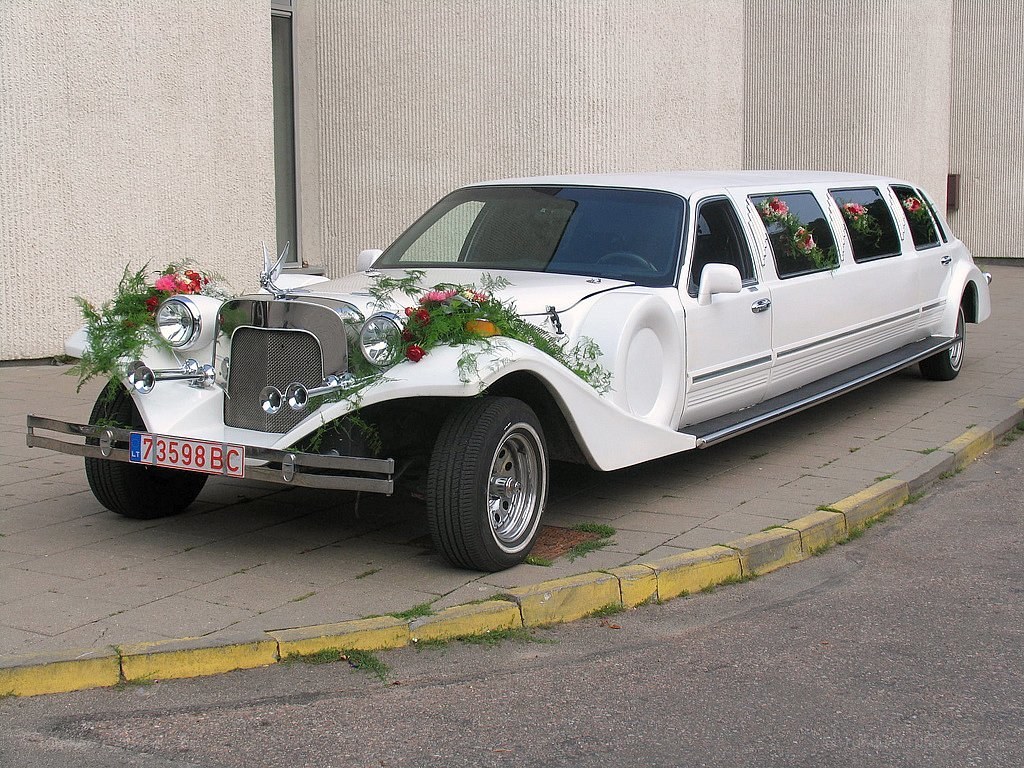 white limousine with flowers