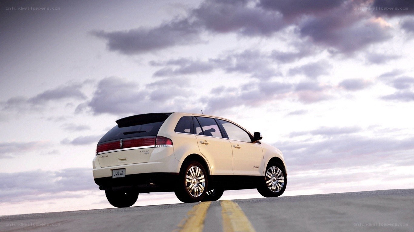 white lincoln mkx on road