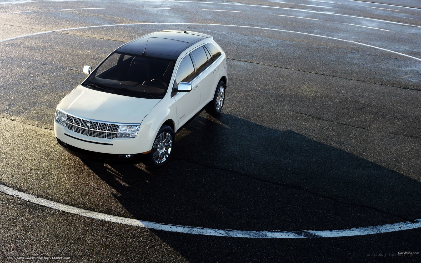 White Lincoln SUV on asphalt