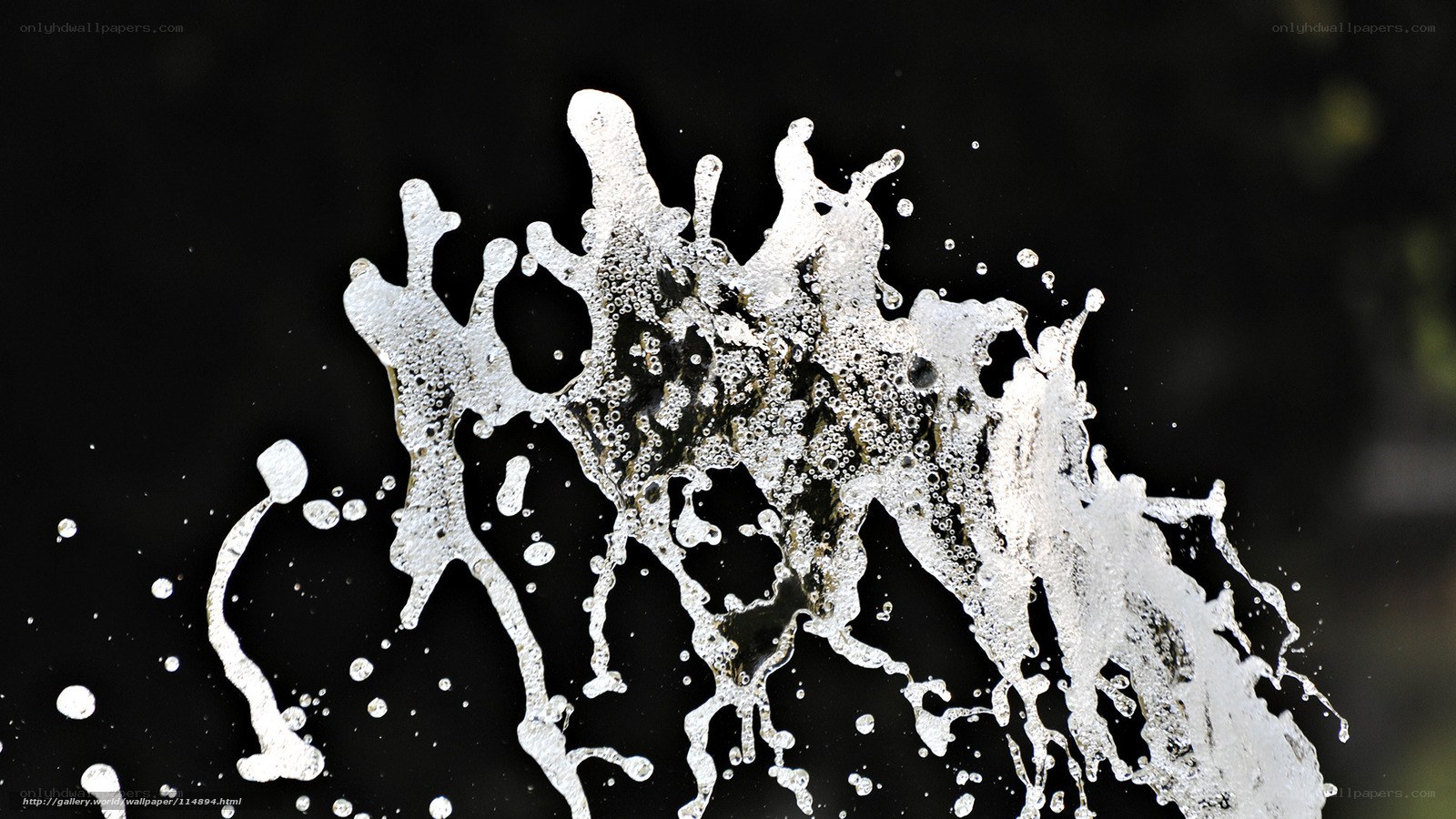white liquid splash on black