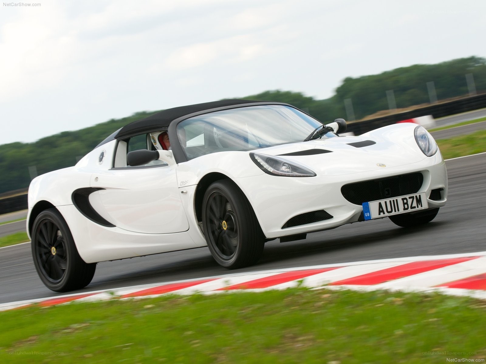white lotus elise on racetrack
